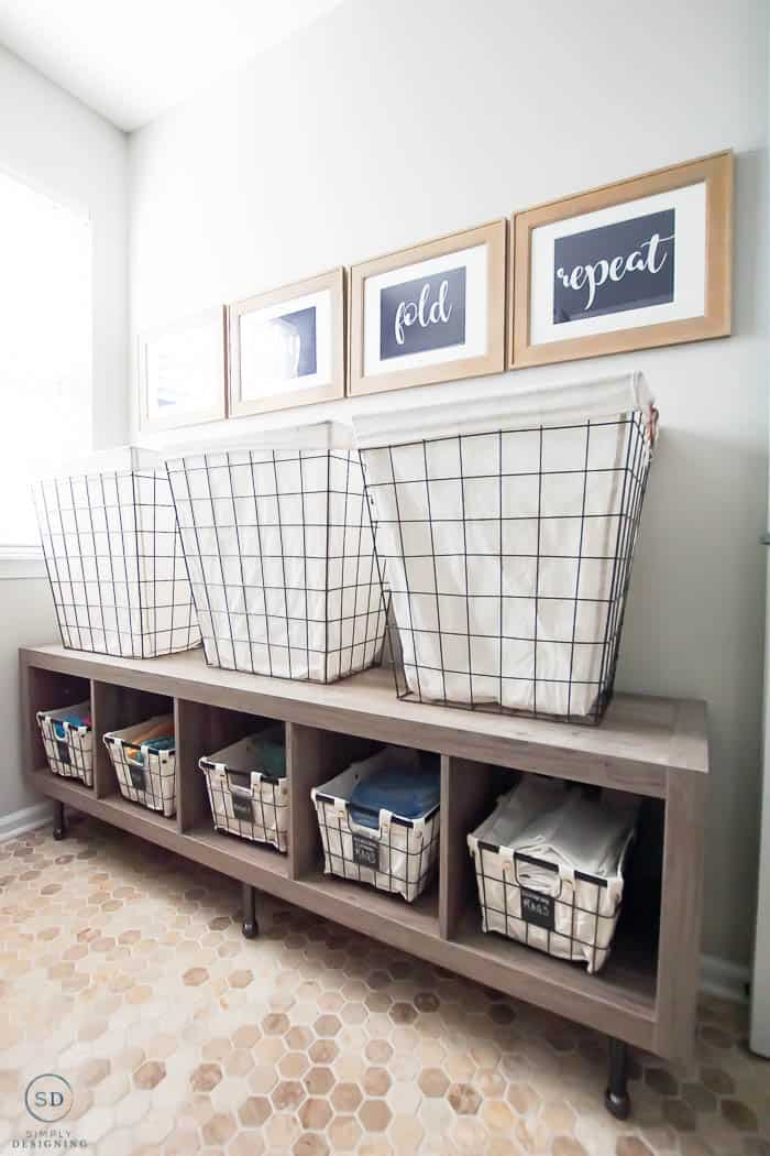 raised laundry basket storage for how to organize a laundry room