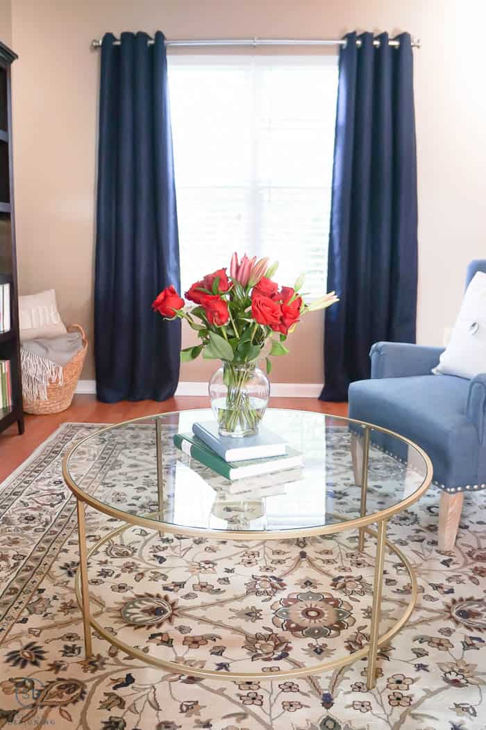 navy blue curtains and gold coffee table in front room makeover