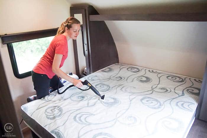 clean and sanitize a bed in an rv or trailer