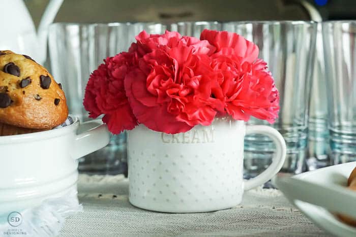 flowers in cream pitcher