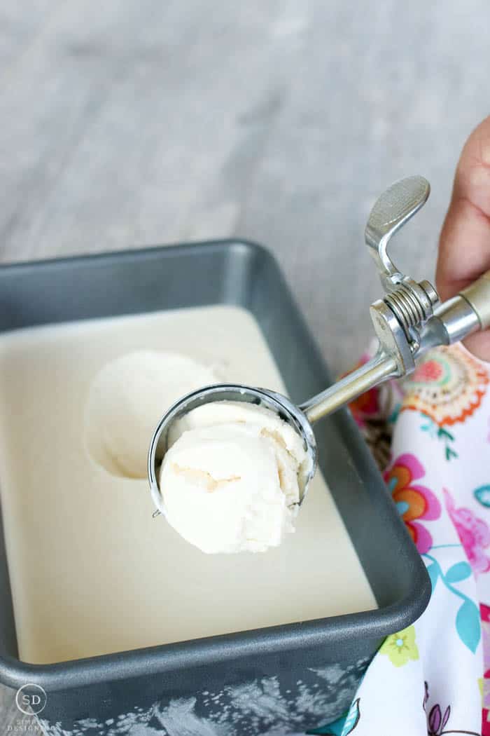 Scooping homemade vanilla ice cream.
