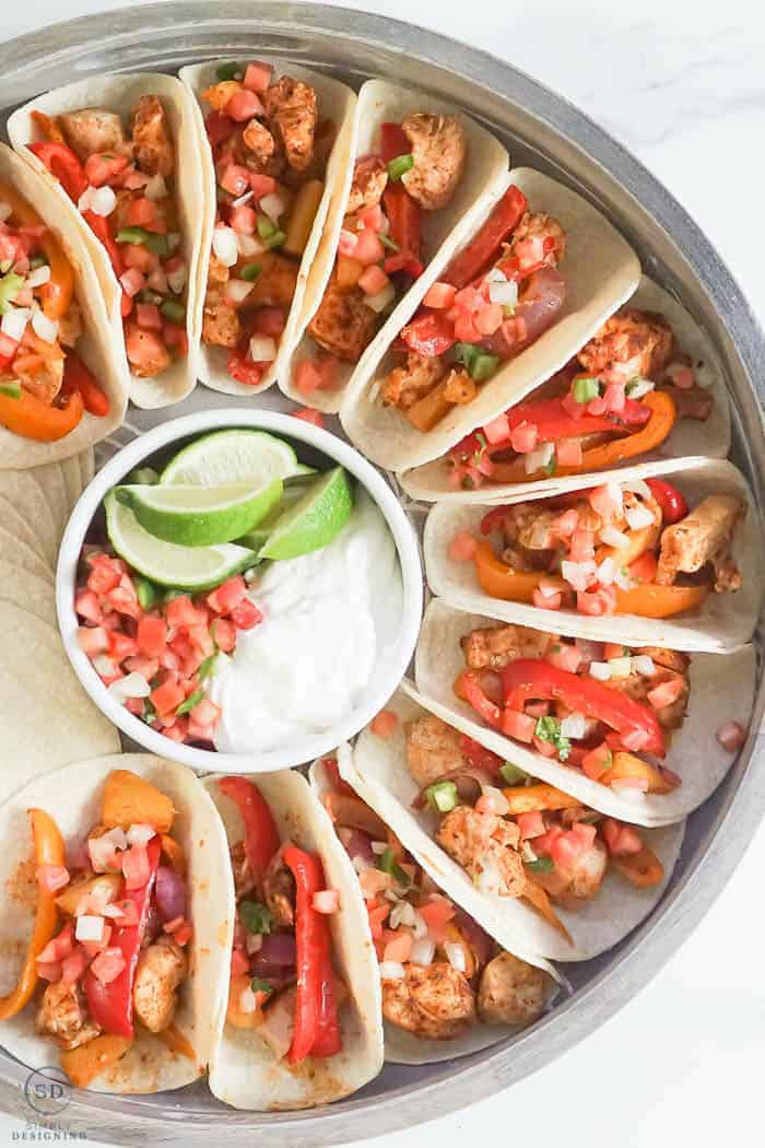 Sheet Pan Chicken Fajitas made in the Oven in a round serving tray