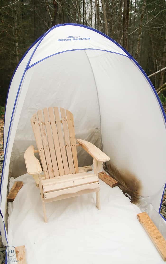raw wood chair in paint spray shelter