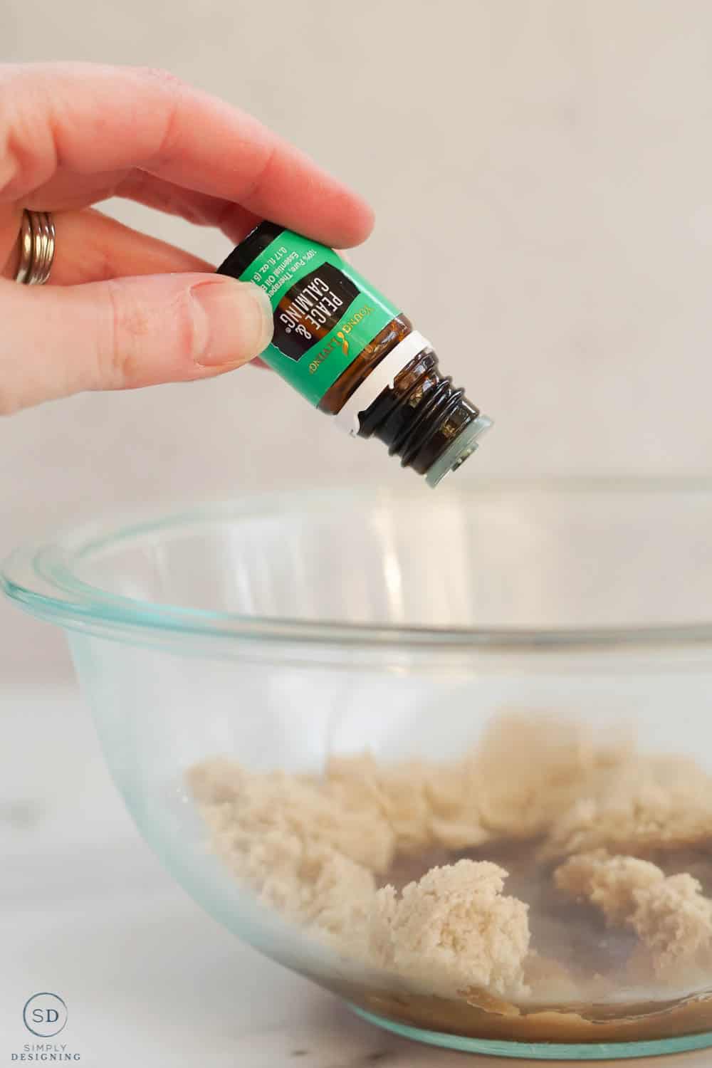 drop peace and calming essential oil into brown sugar
