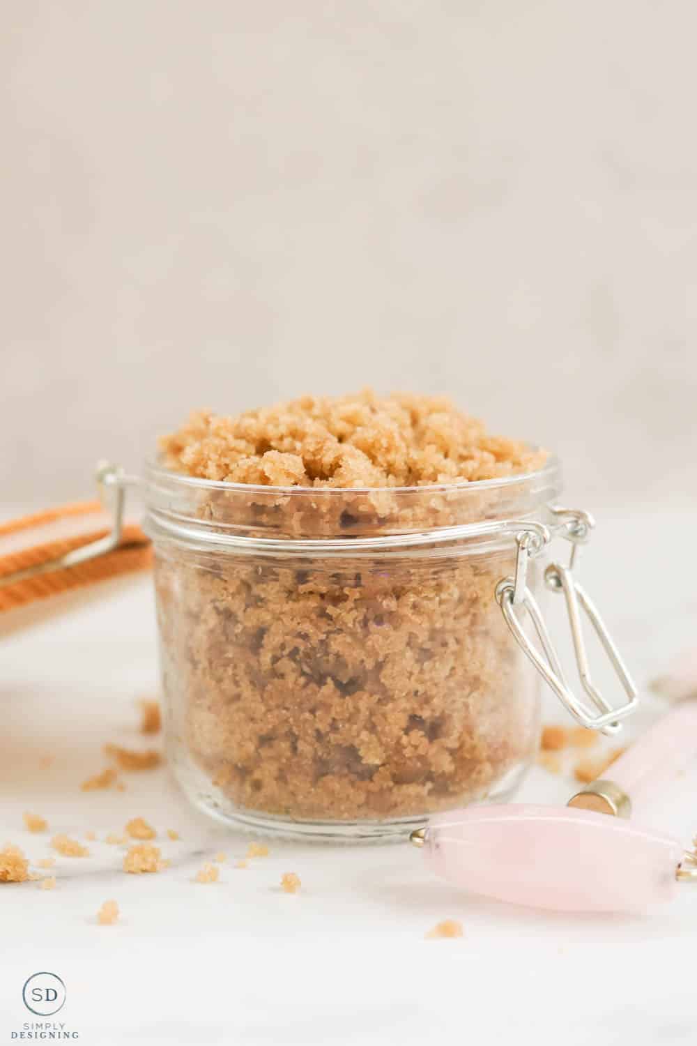 homemade brown sugar face scrub in a glass jar with a wood lid