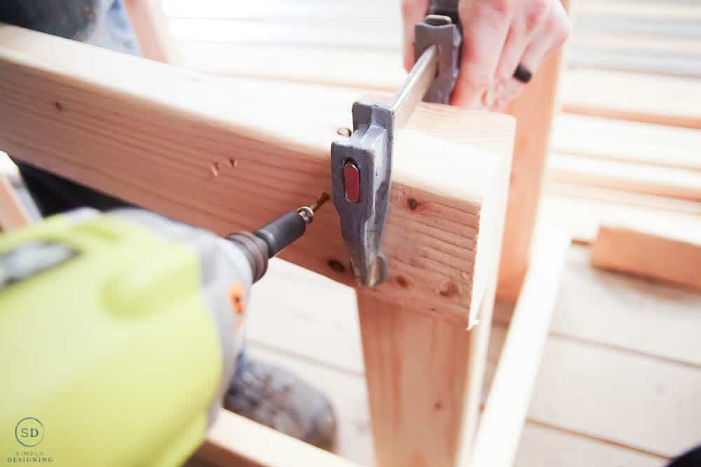 using a clamp to hold boards together while screwing them together