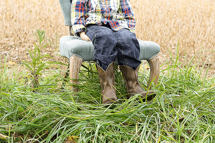 photo of boys legs and Boots in a field