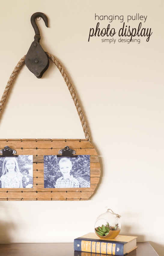 hanging pulley photo display - this is such a great way to resuse a vintage pulley and a few thrift store finds