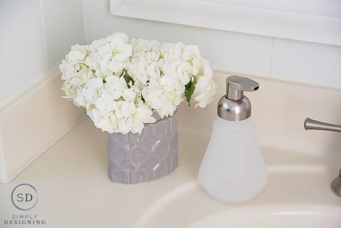 Kids Bathroom Makeover - soap dispenser and flower vase
