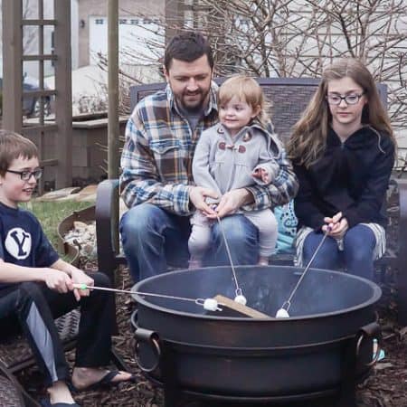 Sitting around a fire pit roasting marshmallows